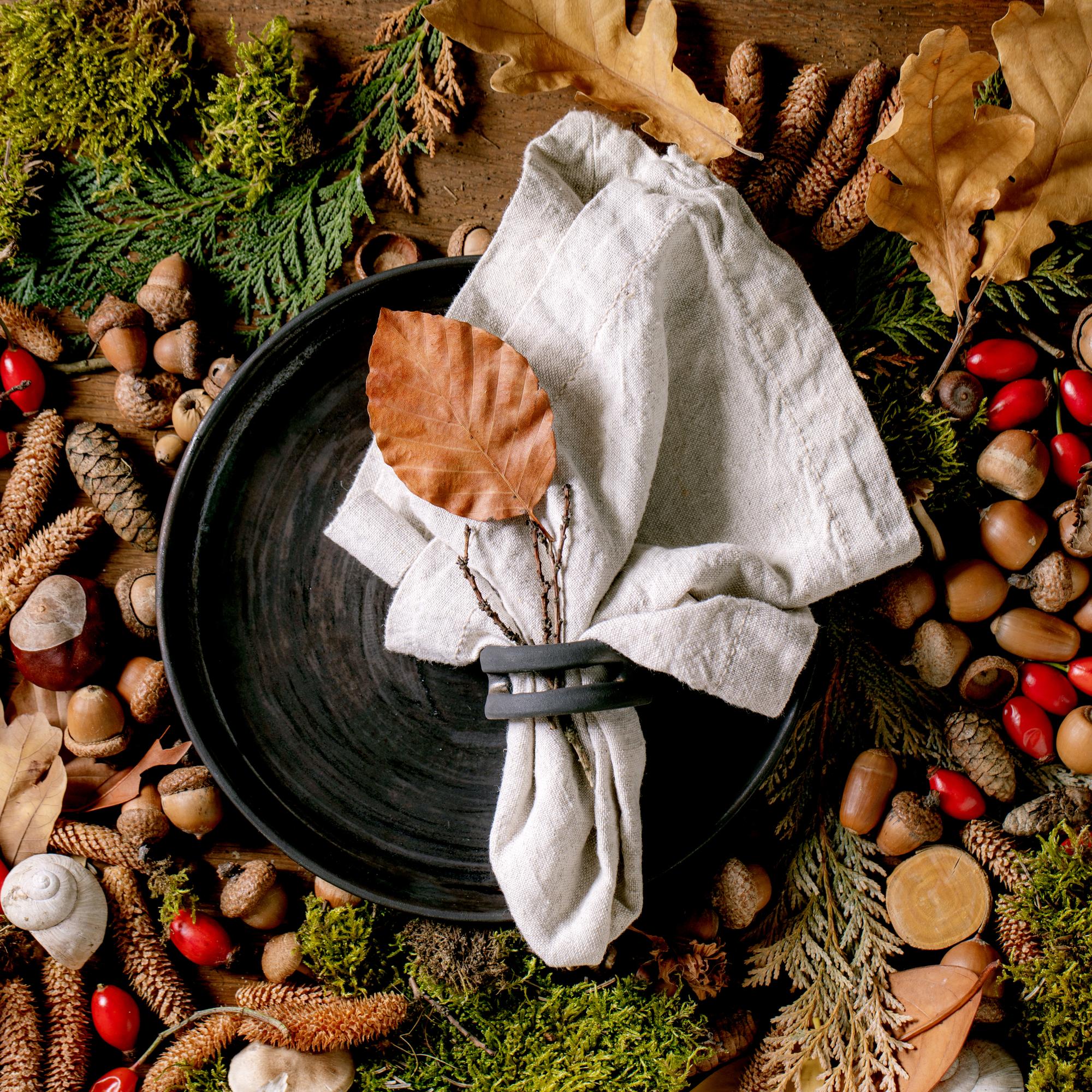 wooden table with plated seasonal dish and linen